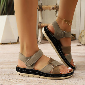 Two-toned brown open-toe platform sandals with adjustable straps.