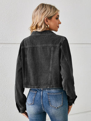 Black cropped denim trucker jacket with buttoned front and collar.