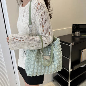 Light Green Textured Grid Pearl Chain Tote Bag with pearl and chain details.