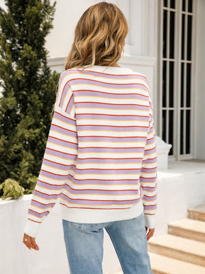 Pastel stripe crewneck knit sweater with lavender, white, red, and yellow stripes.