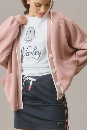 Dusty pink buttoned cocoon cardigan with varsity trim.