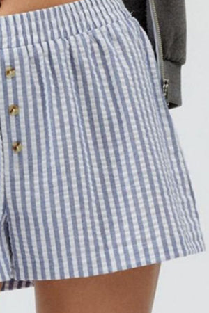 Seersucker boxer shorts in blue and white stripe with button detail and elastic waist.