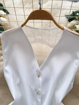White button-down vest coat with lace detail and gold buttons