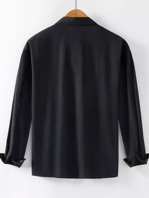 Men's black long sleeve button-up shirt with cuffed sleeves.