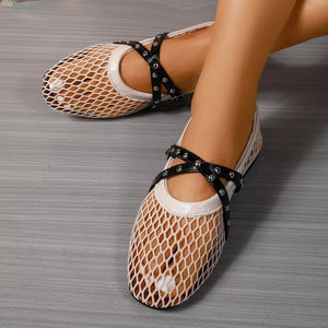 Beige mesh slip-on flats with black crisscross studded straps
