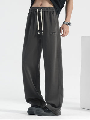 Men's grey casual drawstring sweatpants with embroidered logo detail