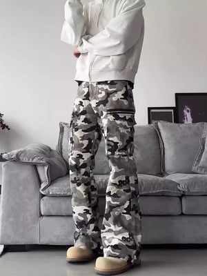 Camouflage utility wide-leg sweatpants with multiple cargo pockets and zippers.