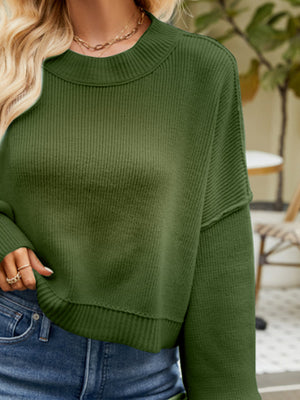 Dropped shoulder knit sweater in Army Green with ribbed texture and crew neck.