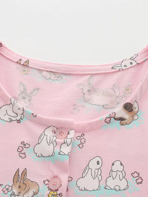 Pink cotton toddler dress with bunny print and button front detail.