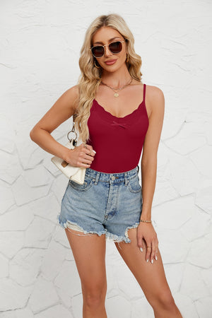 Burgundy ribbed knit cami with lace trim and a bow detail.