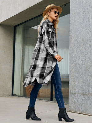 Oversized black and white plaid shirt jacket dress with button front and high-low hem.