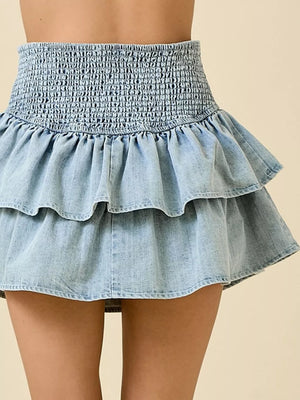 Light blue denim tiered ruffle mini skirt with smocked waist