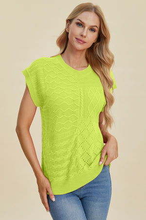 Lime green knit patchwork top with cap sleeves and varied cable and open knit textures.