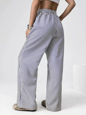 Navy striped high-waisted wide-leg pants with drawstring detail.