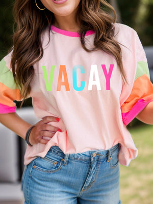 Colorblock vacay graphic tee in watermelon pink with neon trim and colorful sleeves.