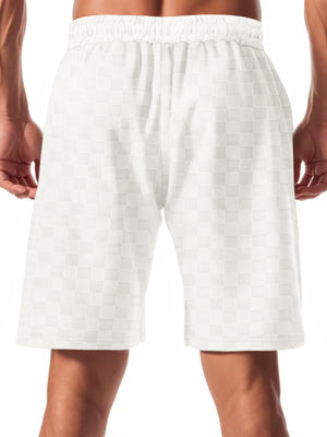 Men's white checkered drawstring chino shorts with elastic waistband.