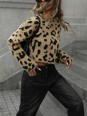 Cropped fuzzy knit sweater with playful leopard print and long sleeves.