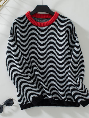 Black and white wavy stripe knit sweater with a red contrast collar.
