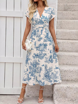 Blue toile print v-neck midi dress with a-line skirt and cinched waist.