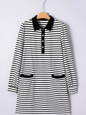 Black and white striped collared long sleeve dress with button front and two front pockets.
