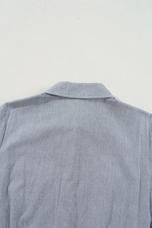 Pinstripe shirred waist romper with tie, close-up of collar and upper back.