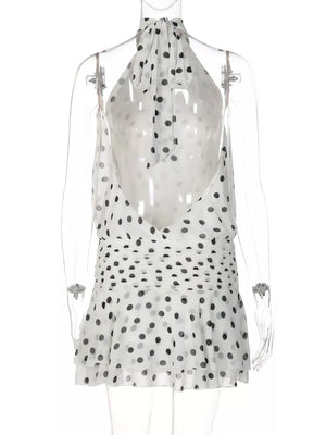 White polka dot halter neck mini dress with ruched waist and tiered hem
