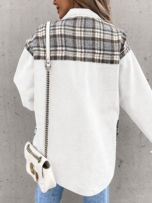 White denim jacket with brown plaid paneling on the upper back and sleeves.