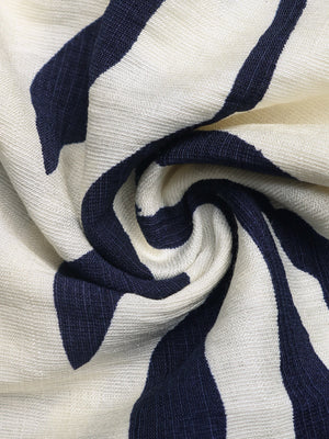 Chic smocked tube romper in navy and white stripe fabric.