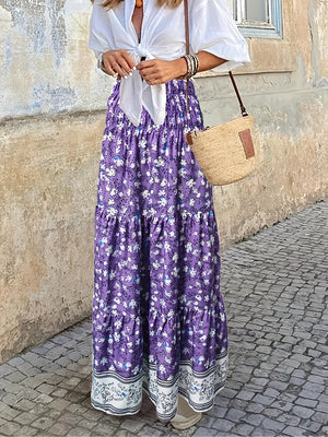 Purple floral maxi tiered skirt with border print hem.