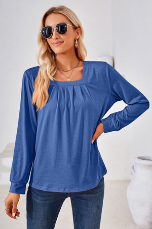Royal blue jersey top with gathered square neckline and long sleeves.