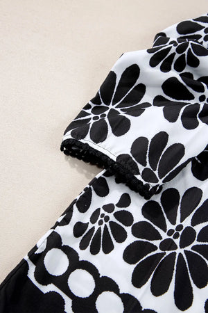 Black floral puff sleeve blouse with lace trim detail