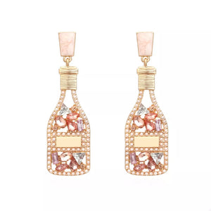 Champagne bottle drop earrings with pink and clear crystals and pearl accents.