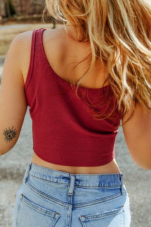 Rust ribbed crop tank top with subtle scoop neckline and tank straps.