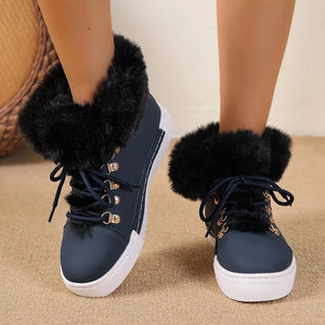 Dark blue round-toe platform boots with fluffy black cuffs and white soles.