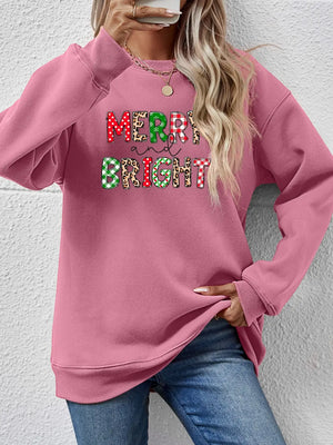 Blush Pink sweatshirt with "Merry and Bright" graphic featuring festive patterns.