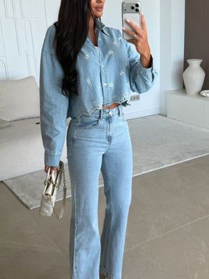 Light blue denim cropped shirt with white floral embroidery and eyelet trim