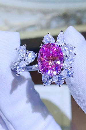 Ring with deep rose oval crystal and clear butterfly design accents.