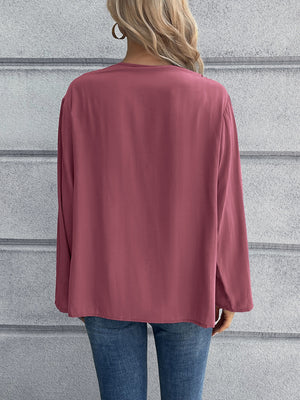 Mandarin collar button-down blouse in a solid color, long sleeves, relaxed fit.
