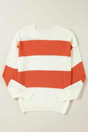 Orange and white striped V-neck knit sweater with a slouchy fit