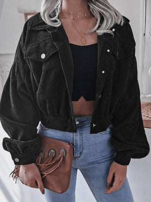 Black corduroy cropped jacket with balloon sleeves and button-up front.