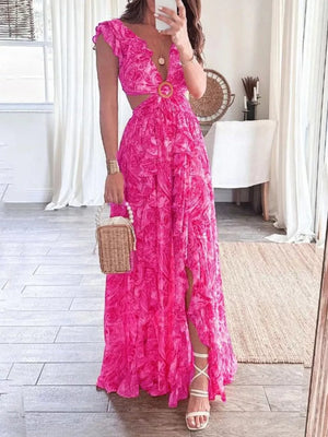 Pink ruffled V-neck maxi dress with cut-outs and a wood ring detail.
