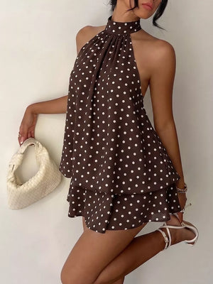 Chic polka dot halter mini dress in coffee brown with a ruffled hem.