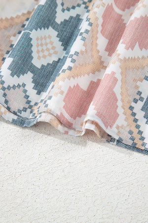 Geometric print blouse in floral color with tassel tie detail