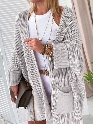 Cozy open front cardigan in light gray acrylic knit with pockets and a relaxed fit.