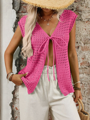 Fuchsia pink open-knit sleeveless cardigan with tie-front detail and deep V-neckline.