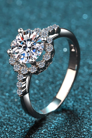 Silver halo cluster moissanite engagement ring with pave band.