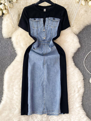Denim patchwork short-sleeve dress with button-down front and black contrast panels.