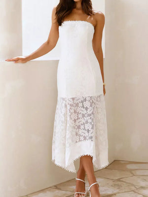 White lace strapless midi dress with floral overlay and pom-pom trim.