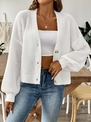 White balloon sleeve button-down knit cardigan with button details and a relaxed fit.