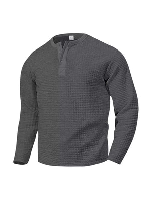 Men's dark gray waffle knit long sleeve henley t-shirt with button placket.